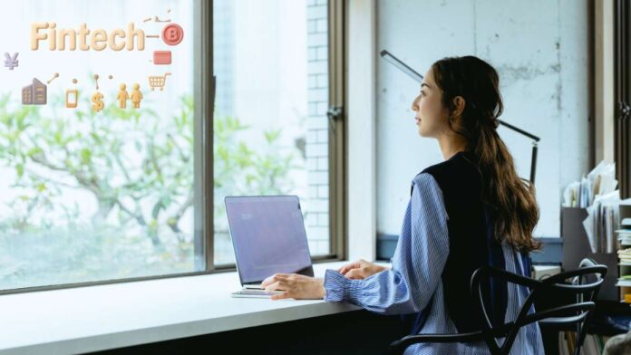 Woman working on fintech at desk
