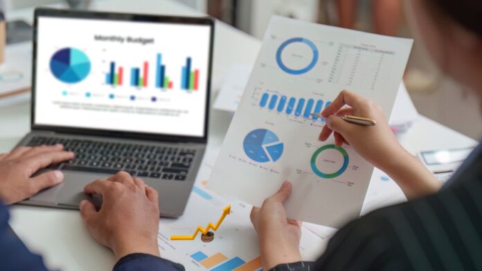 Analyzing financial data and charts.